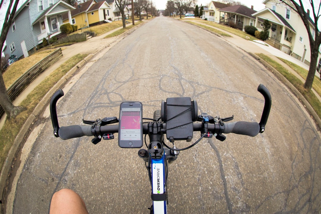 grayscale photography of man sitting on stair